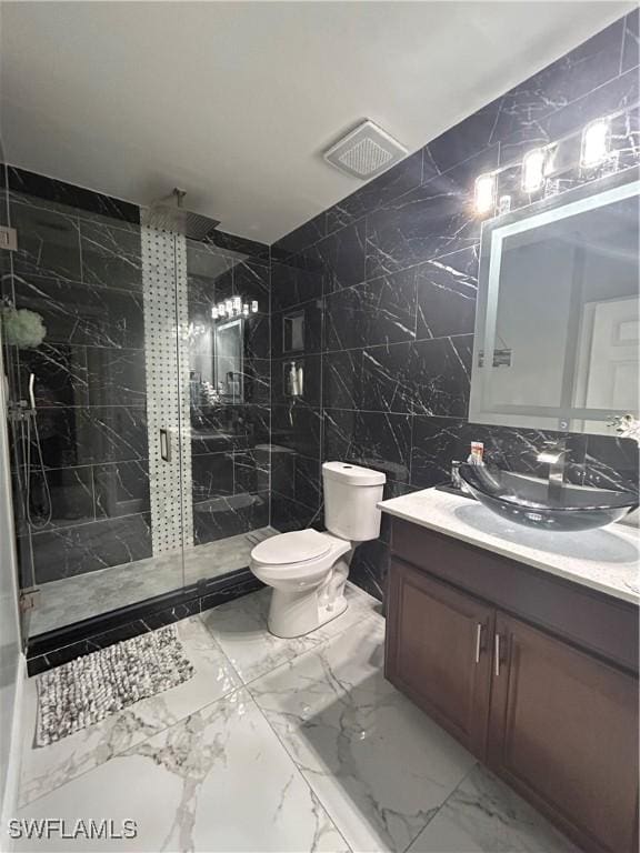 full bathroom featuring a marble finish shower, visible vents, marble finish floor, vanity, and tile walls