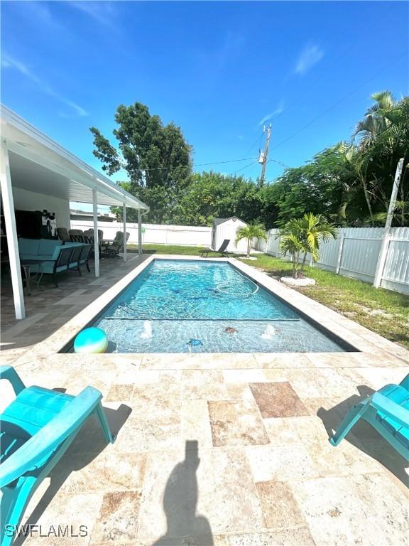 view of pool with a fenced in pool, a patio area, and a fenced backyard