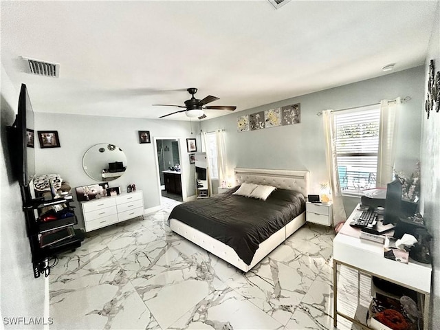 bedroom with ceiling fan, marble finish floor, and visible vents