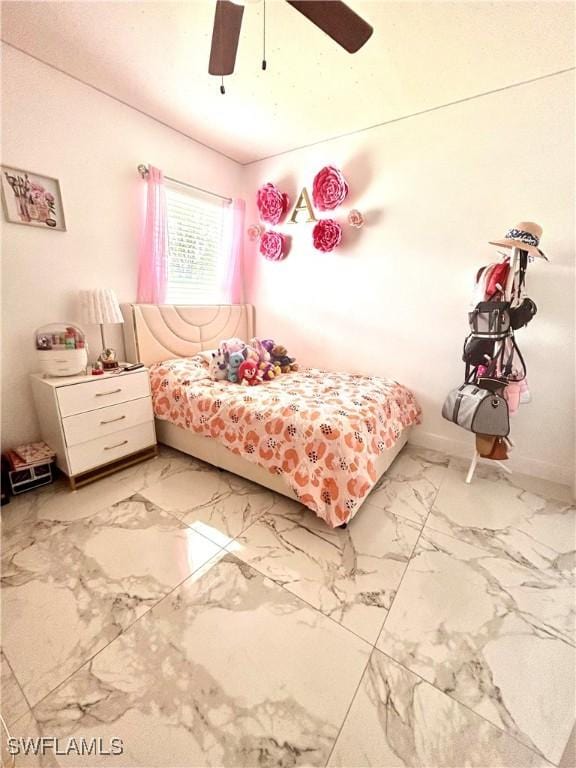 bedroom featuring marble finish floor, ceiling fan, and baseboards