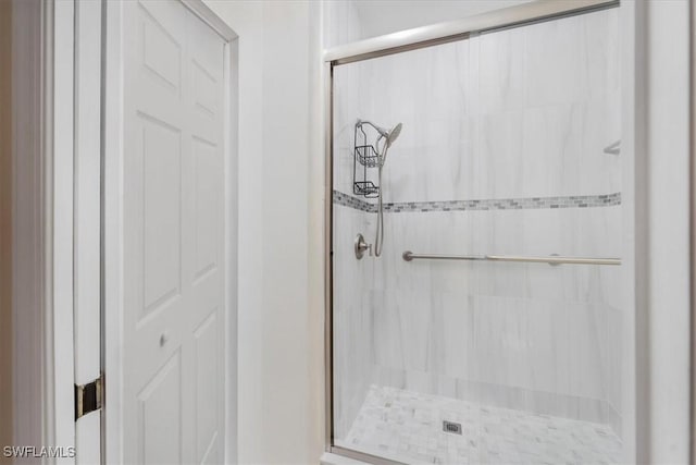 bathroom with a shower stall