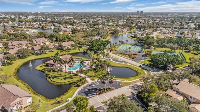 birds eye view of property with a water view and a residential view