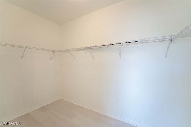 walk in closet featuring light wood-style floors