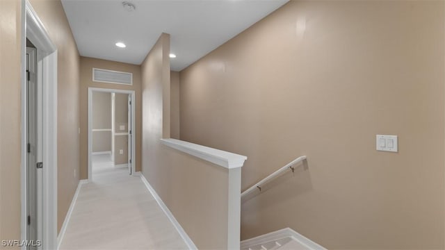 corridor featuring visible vents, recessed lighting, an upstairs landing, and baseboards