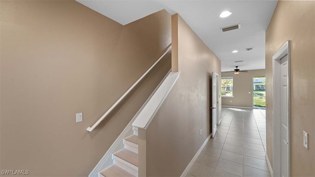 hall with visible vents, baseboards, stairs, light tile patterned flooring, and recessed lighting