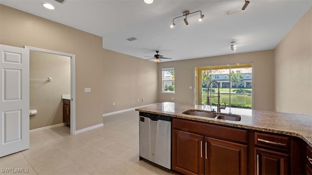 kitchen with visible vents, a ceiling fan, a sink, dishwasher, and baseboards