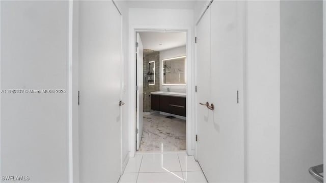 corridor featuring light tile patterned floors