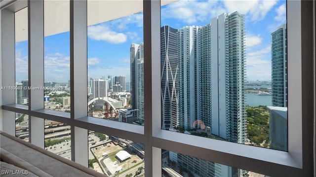 interior space featuring a view of city and a water view