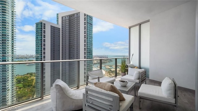 balcony with a view of city and a water view