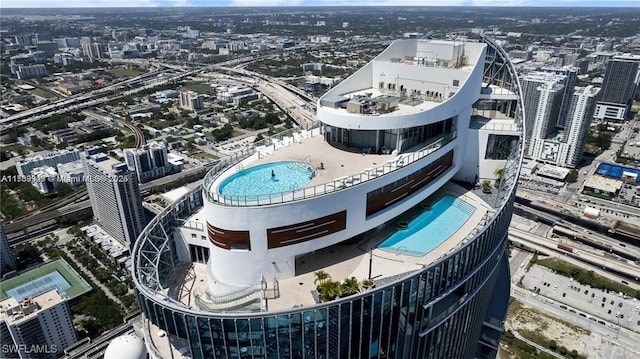 birds eye view of property with a city view