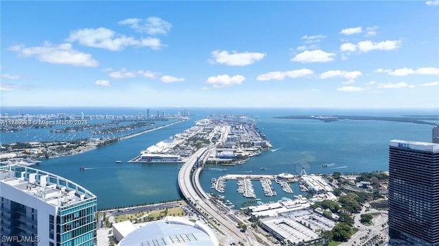 birds eye view of property featuring a view of city and a water view