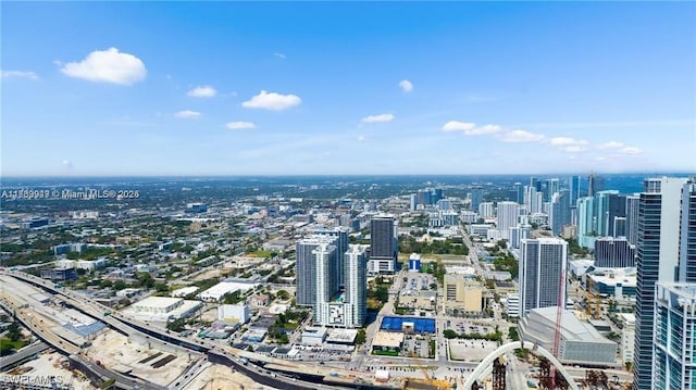 birds eye view of property with a view of city