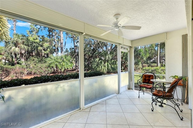 sunroom / solarium with ceiling fan