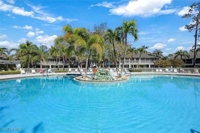 view of pool featuring fence