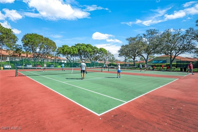 view of sport court featuring fence