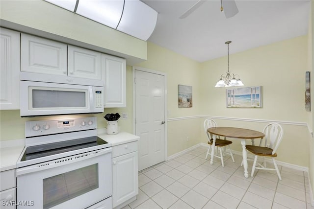 kitchen featuring white appliances, white cabinets, decorative light fixtures, light countertops, and ceiling fan with notable chandelier