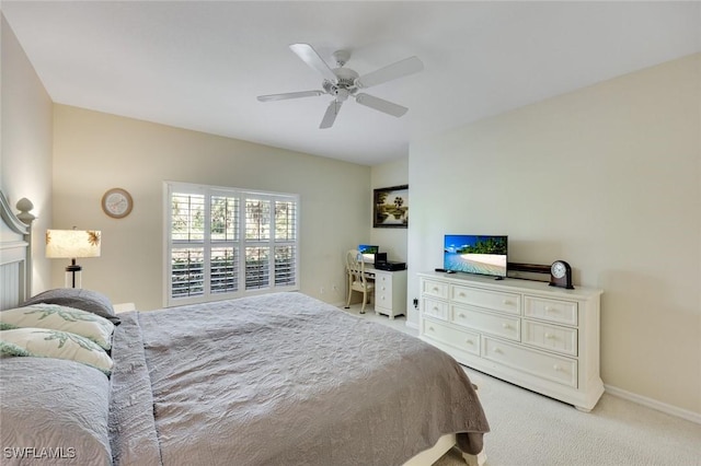 bedroom with ceiling fan, carpet floors, and baseboards