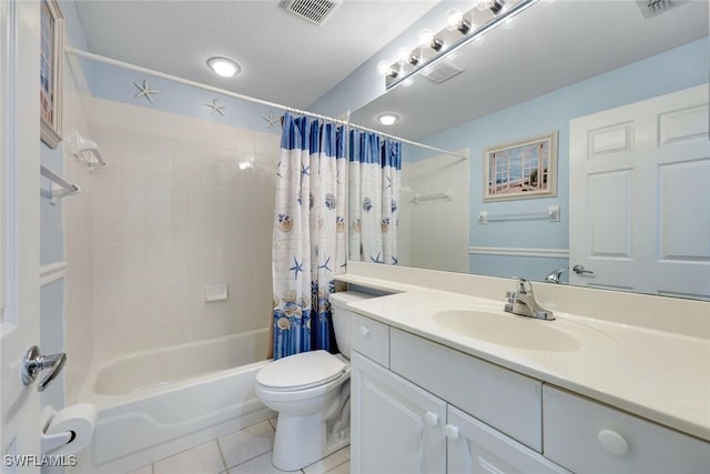 full bath with tile patterned flooring, toilet, vanity, visible vents, and shower / bath combo with shower curtain