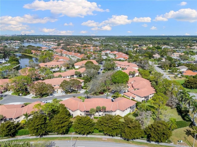 aerial view with a residential view and a water view