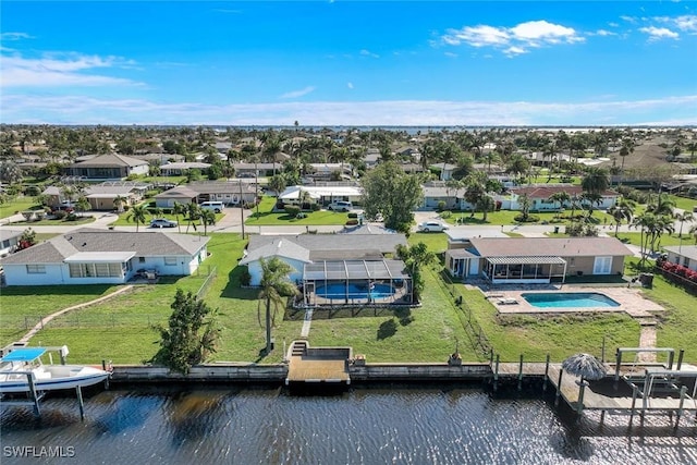 bird's eye view with a residential view and a water view