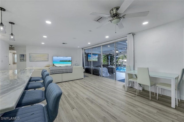 living area featuring visible vents, recessed lighting, light wood-type flooring, and ceiling fan