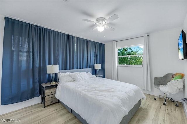 bedroom featuring ceiling fan and wood finished floors