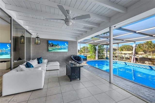 outdoor pool with a patio area, glass enclosure, outdoor lounge area, and ceiling fan