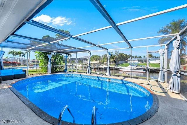 pool with glass enclosure, a water view, a patio, and a boat dock