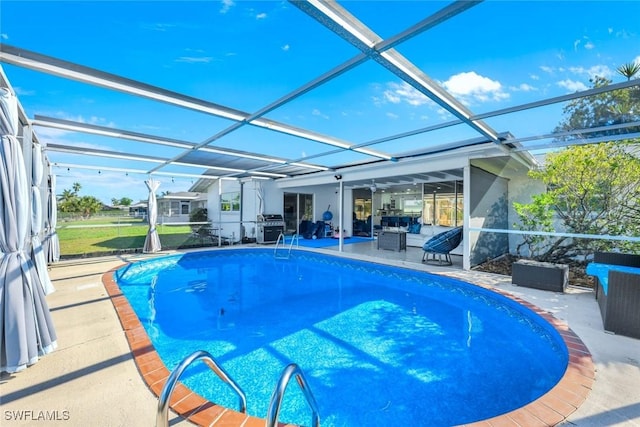 pool with area for grilling, glass enclosure, and a patio