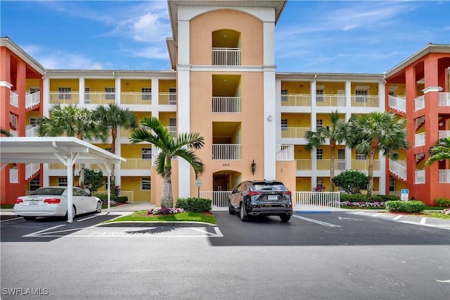 view of property with uncovered parking