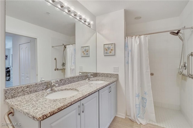 full bath with a sink and tiled shower