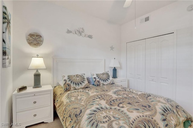 bedroom with a ceiling fan, a closet, and visible vents