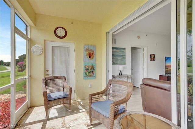 sunroom featuring visible vents