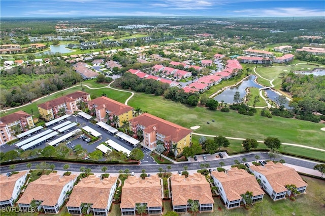 bird's eye view featuring a residential view, view of golf course, and a water view