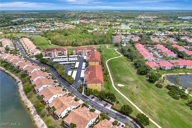 aerial view with a water view, a residential view, and golf course view