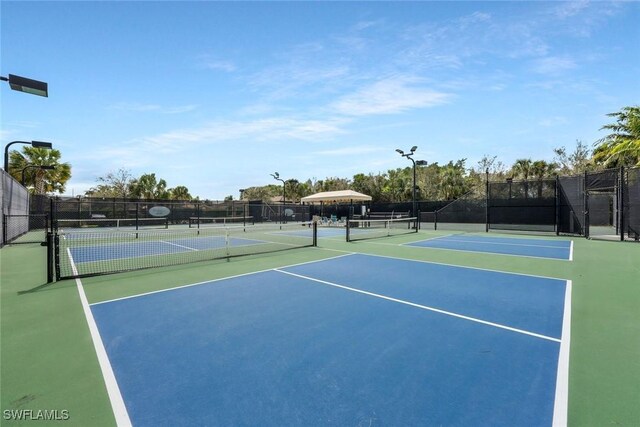 view of sport court with fence