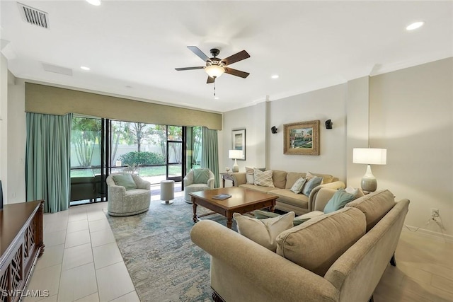 living room featuring a ceiling fan, visible vents, and recessed lighting