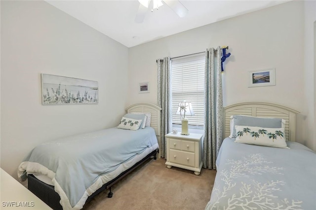 bedroom with light carpet and ceiling fan