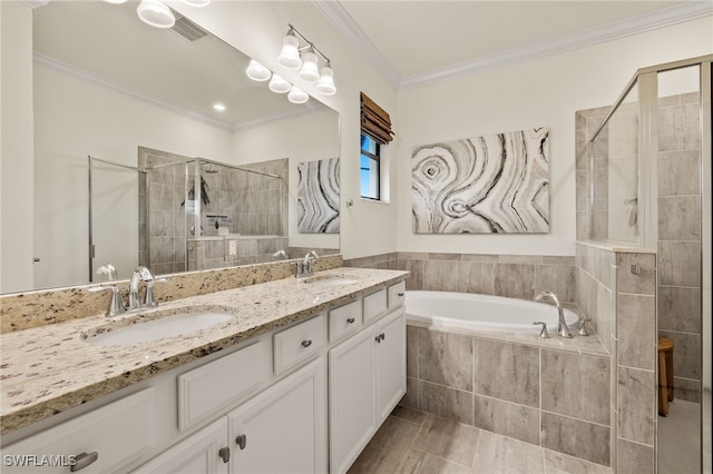 full bathroom featuring ornamental molding, a stall shower, and a sink