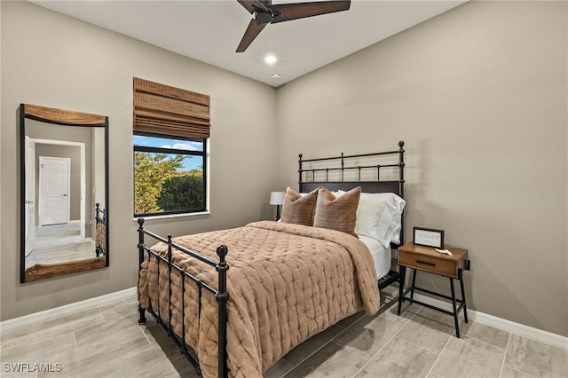 bedroom featuring baseboards and a ceiling fan