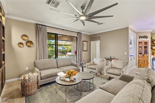 living room featuring baseboards, ornamental molding, visible vents, and light wood-style floors