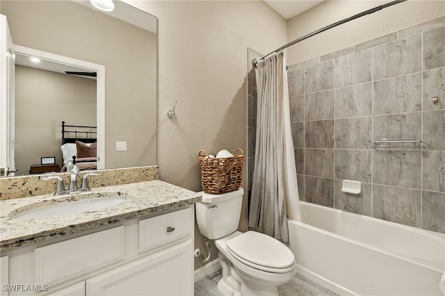 full bath with shower / bath combo with shower curtain, vanity, toilet, and ensuite bathroom