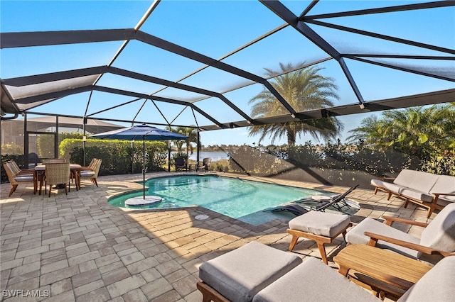 pool with a patio and a lanai