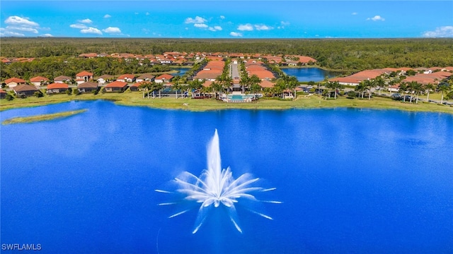 birds eye view of property featuring a water view and a residential view