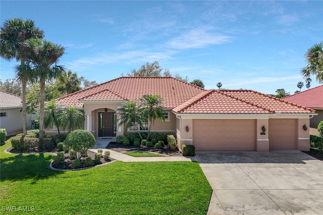 mediterranean / spanish-style house featuring stucco siding, concrete driveway, an attached garage, a tiled roof, and a front lawn