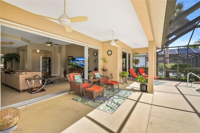 view of patio / terrace with glass enclosure, ceiling fan, and an outdoor hangout area