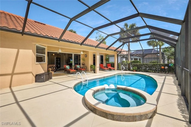 view of pool featuring a patio area and a pool with connected hot tub