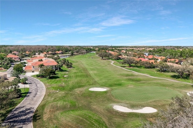 bird's eye view with view of golf course