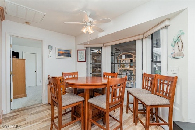 dining room featuring light wood-style floors and ceiling fan