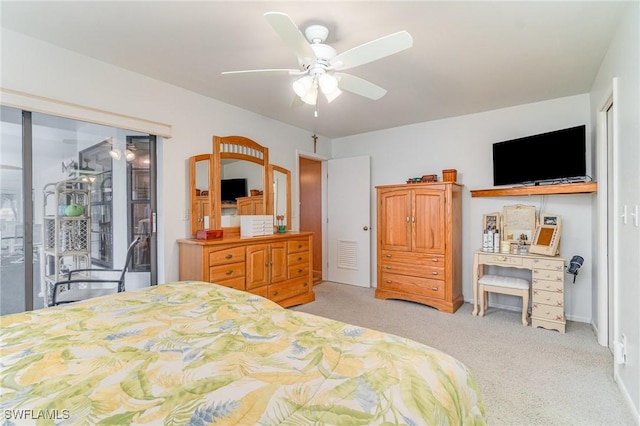 bedroom featuring ceiling fan, visible vents, and light colored carpet